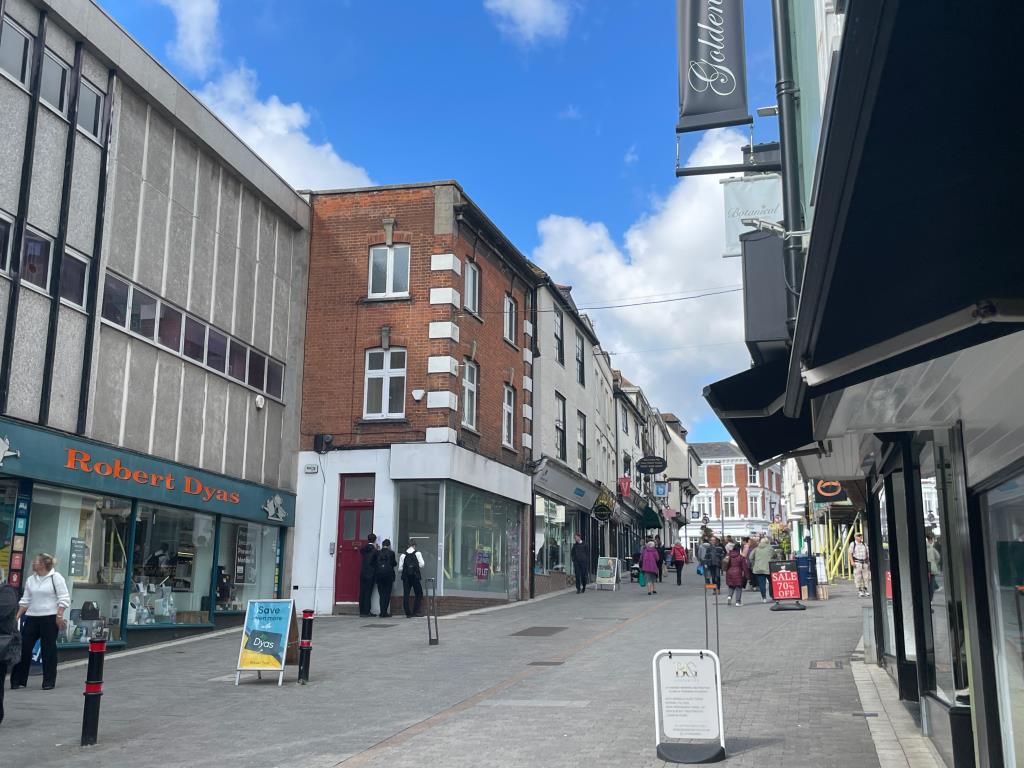 Lot: 40 - TOWN CENTRE COMMERCIAL INVESTMENT WITH PLANNING FOR CONVERSION OF UPPER FLOORS - Street view of commercial investment with planning for conversion of upper floors